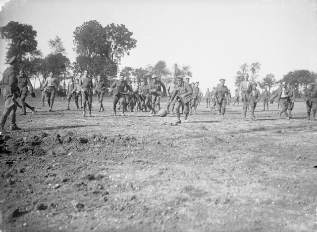 English soldiers play football in France 1916, Courtesy of Imperial War Museum