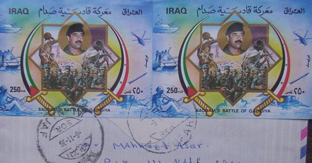 A letter with large Iraqi stamps depicting Saddam Hussein.