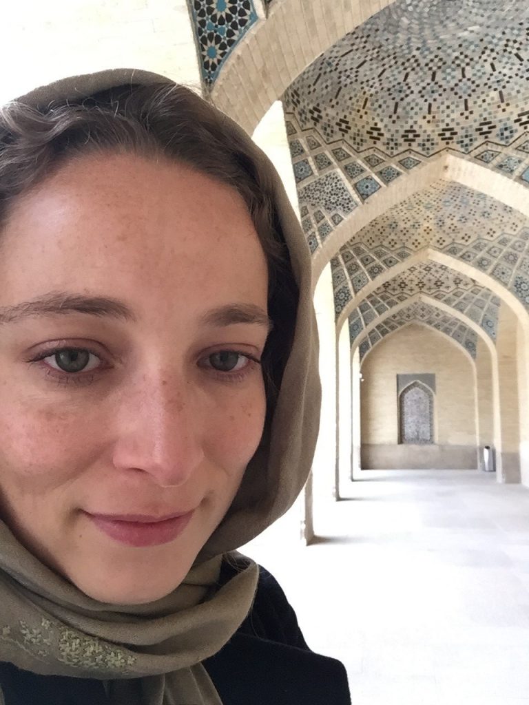 A self portrait photograph of the author, Laetitia Nanquette. She is a woman wearing a pale brown headscarf standing in a mosque. Photo taken by the author in Nasir al-Mulk Mosque, Shiraz (March 2017)