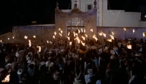 A mob wields flaming torches in a frame from Canoa: A Shameful Memory (1976)