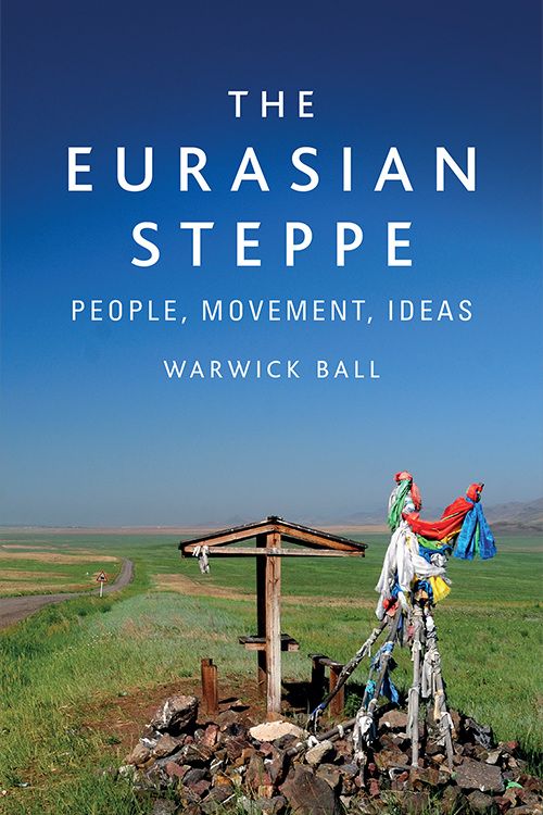 The cover image of The Eurasian Steppe showing a cloth-wrapped shrine in the foreground and a huge blue sky in the background, photo taken by Warwick Ball.