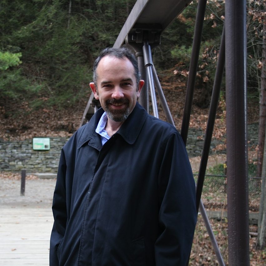 A photo of Robert Miner standing in a park