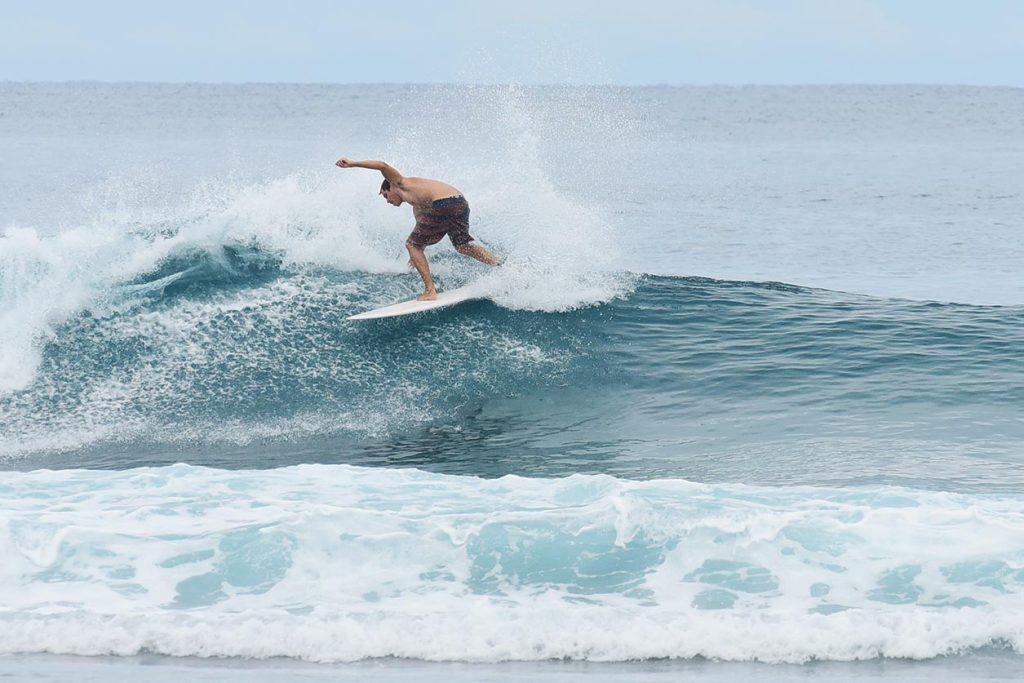 A man surfing on a wave