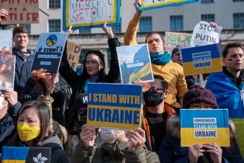 Crowds protesting the invasion of Ukraine (Photo from Unsplash)