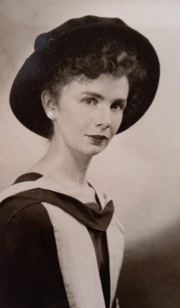 A black and white photo of Margaret McGowan in graduation robes