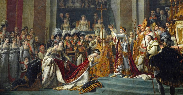 Napoleon holds a crown and stands above a kneeling Josephine in Notre Dame Cathedral. They are surrounded by a large crowd of people and all are dressed similarly in bright colors.