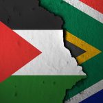 Half of the Palestinian flag layered over half of the South African flag