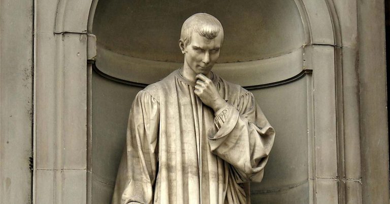 A photograph of the statue of Machiavelli in Florence: he has his hand raised to his chin in thought