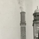 black and white picture of a chimney stack and a bell tower