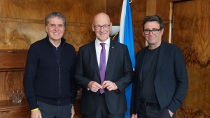 John Swinney with the Mayors of Liverpool City Region and Greater Manchester. Swinney is standing in the middle, with the mayors either side. They are all smiling and looking straight ahead.
