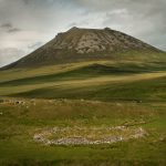 A circular sheep stell (shelter) at Wagmore with Morven hill behind