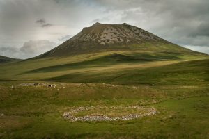 A circular sheep stell (shelter) at Wagmore with Morven hill behind