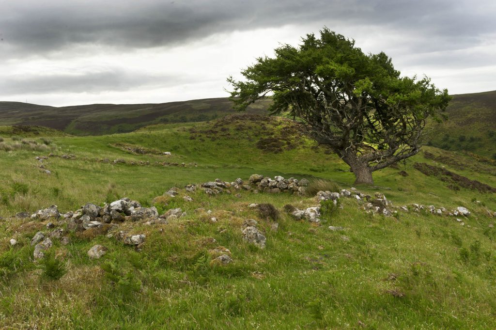 A pile of stones at Dùn marks the site of an early dwelling