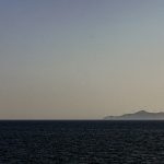 A sunsets below an ocean horizon