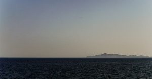 A sunsets below an ocean horizon