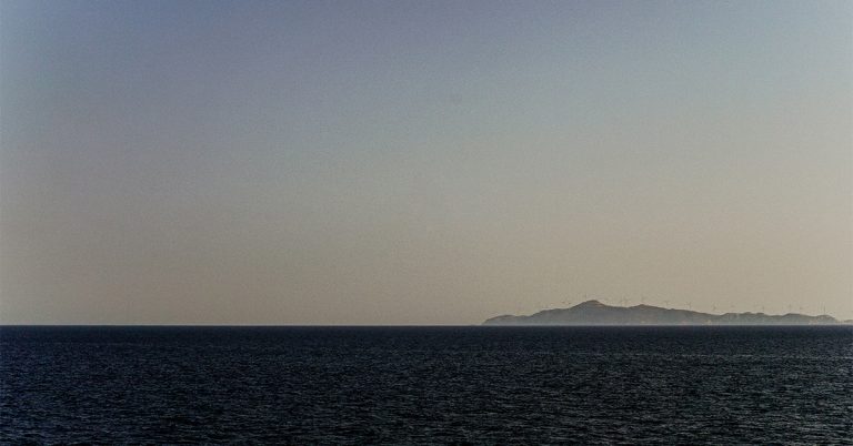 A sunsets below an ocean horizon