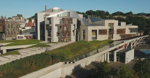 An aerial photograph of the Scottish Parliament building at the bottom of the Royal Mile, Edinburgh