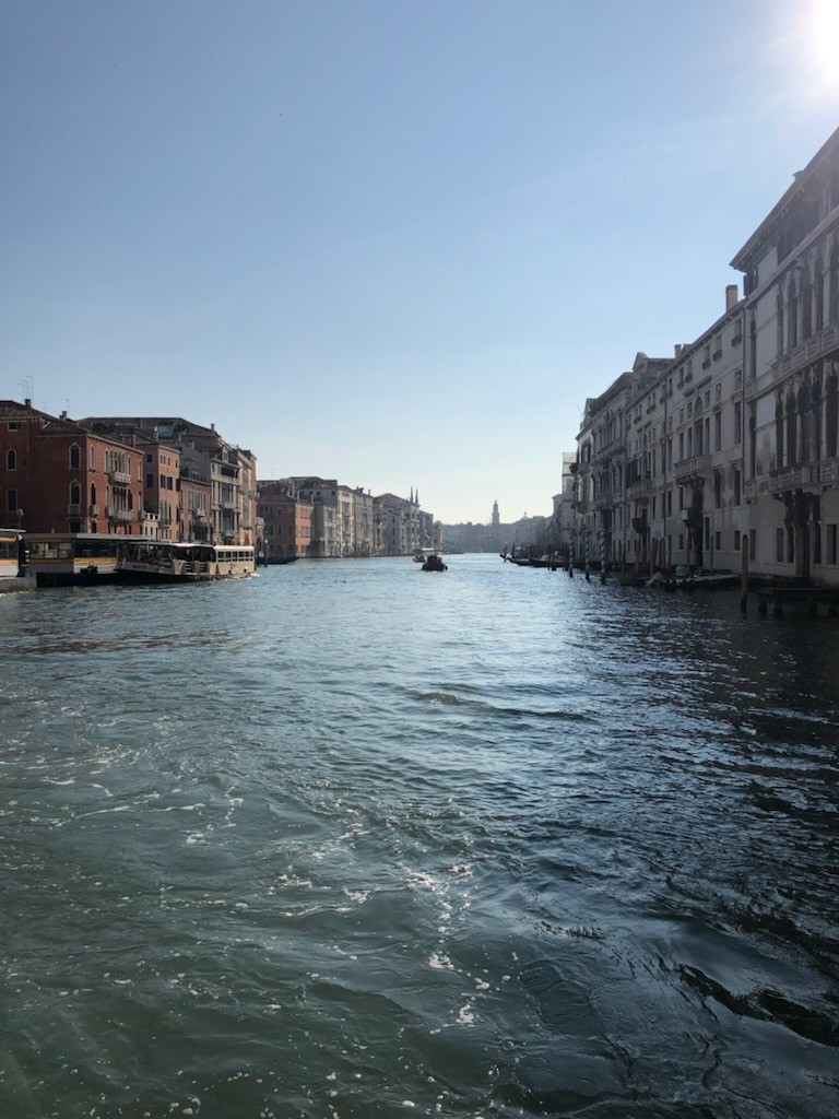 Photograph of Venice with view of houses, boats, and canal