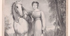 Young white woman standing next to a white horse.