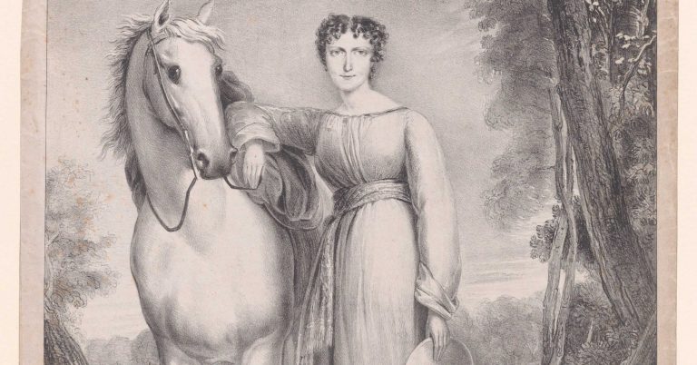 Young white woman standing next to a white horse.